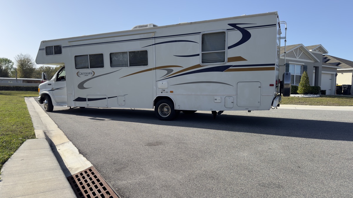 Class C motorhome bought for cash, rear three-quarter view — serving Tampa