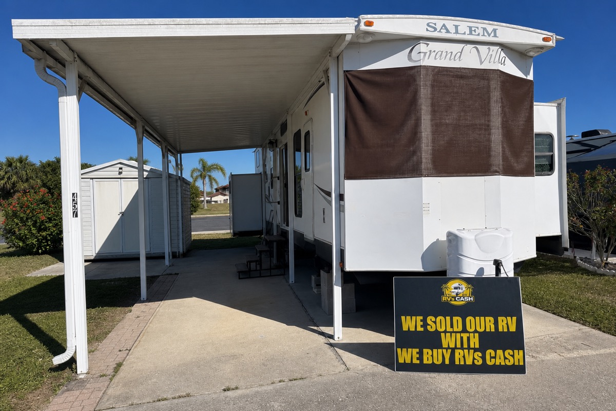 Park model seen down the length of its awning — We Buy RVs Cash, Florida