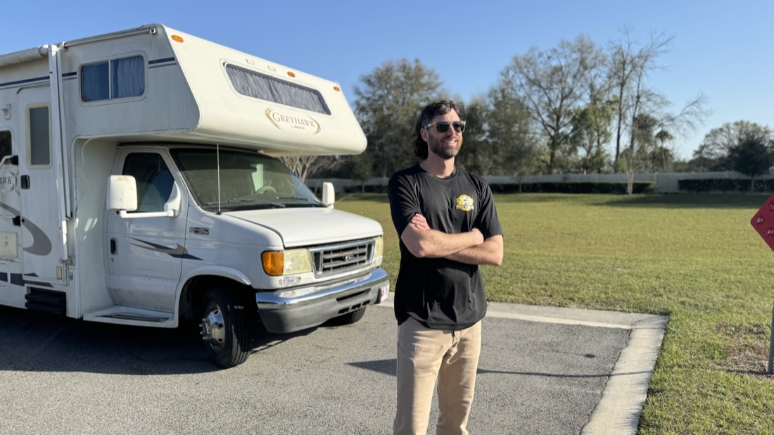 We Buy RVs Cash buyer standing with a motorhome he purchased — serving Winter Haven